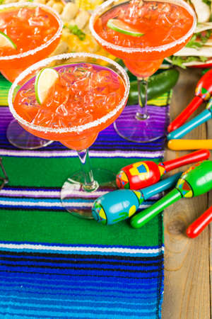 Fiesta party buffet table with watermelon margaritas and other traditional Mexican food.の写真素材