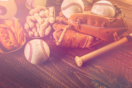 Game day traditional snacks included corndogs and salted peanuts on a wood board.の写真素材