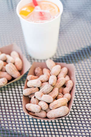 Street food lunch with peanuts, hotdog, and hamburger.の写真素材