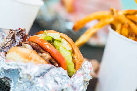 Street food lunch with peanuts, hotdog, and hamburger.の写真素材