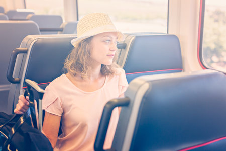 Young woman traveling from train station to International Airport.