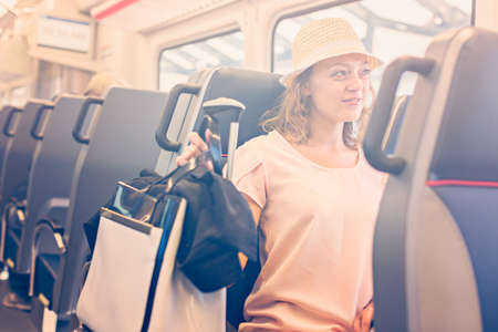 Young woman traveling from train station to International Airport.の写真素材