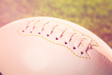 American Football Close up on on green grass.の写真素材