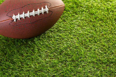 American Football Close up on on green grass.の写真素材