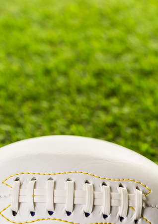 American Football Close up on on green grass.の写真素材