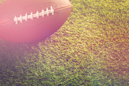 American Football Close up on on green grass.