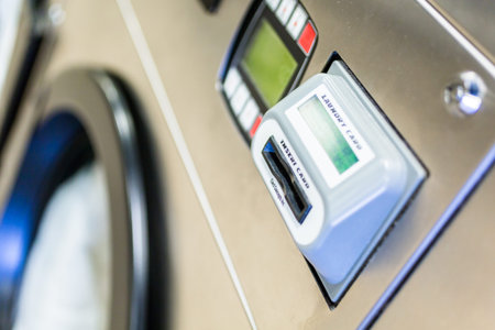 Industrial washing machines in a public laundry.の写真素材