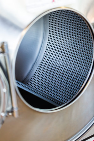 Industrial washing machines in a public laundry.