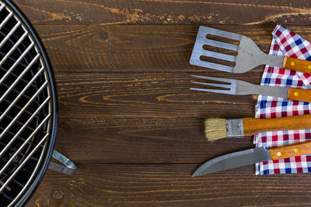 Stainless steel barbecue cooking set with wood handles.の写真素材