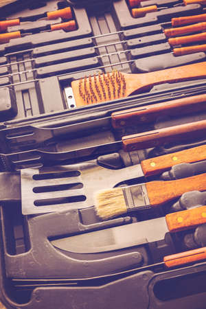 Stainless steel barbecue cooking set with wood handles.の写真素材