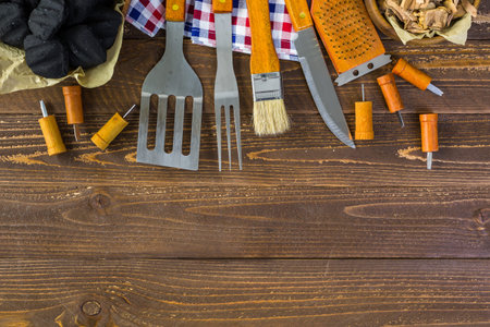 Stainless steel barbecue cooking set with wood handles.の写真素材
