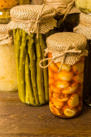 Homemade canned organic vegetables in glass jars.の写真素材
