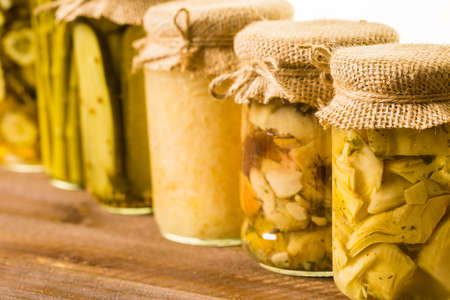 Homemade canned organic vegetables in glass jars.の写真素材