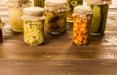 Homemade canned organic vegetables in glass jars.