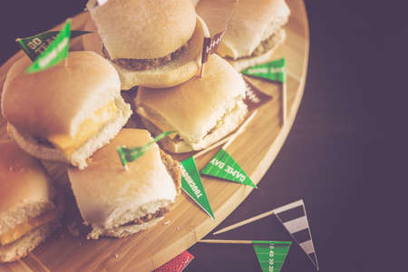 Sliders with veggie tray on the table for the football party.の写真素材