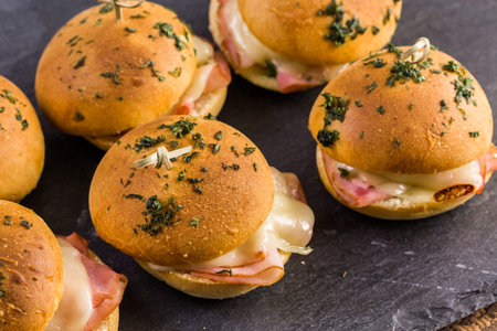 Ham and cheese sliders on homemade dinner rolls.の写真素材
