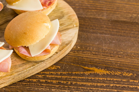 Ham and cheese sliders on homemade dinner rolls.の写真素材