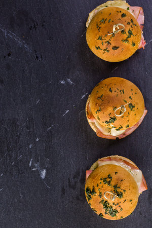 Ham and cheese sliders on homemade dinner rolls.