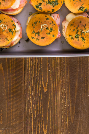 Ham and cheese sliders on homemade dinner rolls.の写真素材