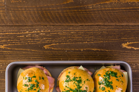 Ham and cheese sliders on homemade dinner rolls.の写真素材