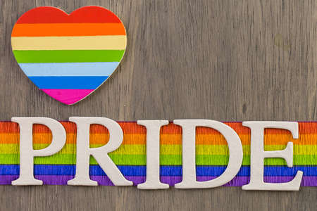 Rainbow Gay Pride sign on wood background.の写真素材