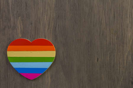Rainbow Gay Pride heart on a wood background.の写真素材