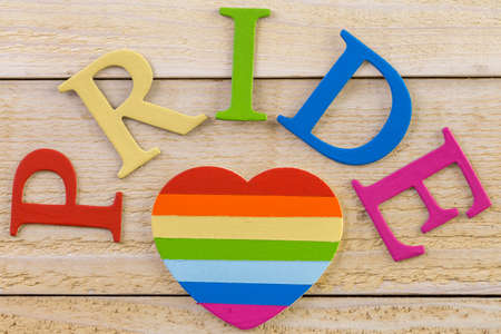 Rainbow Gay Pride sign on wood background.の写真素材