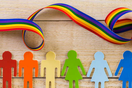 Rainbow Gay Pride male and female figures on wood background.の写真素材