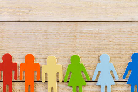 Rainbow Gay Pride male and female figures on wood background.の写真素材