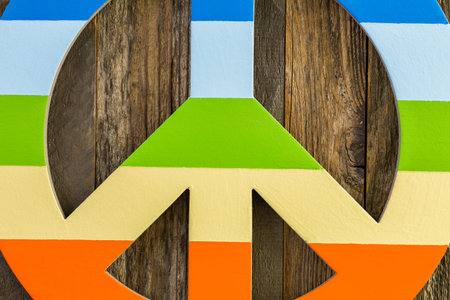 Rainbow Gay Pride peace sign on a wood backgroundの写真素材