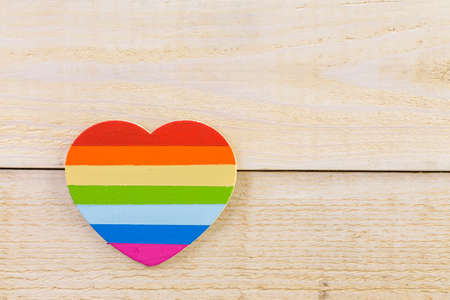 Rainbow Gay Pride heart on a wood background.の写真素材