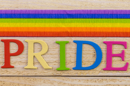 Rainbow Gay Pride sign on wood background.の写真素材