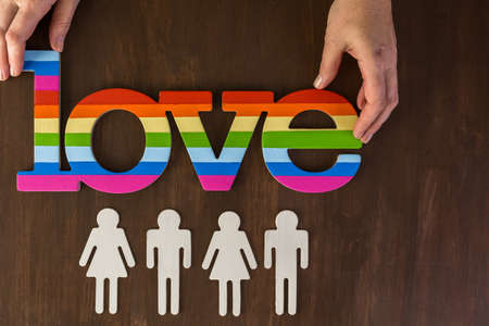 Rainbow Gay Pride Love sign on wood background.の写真素材