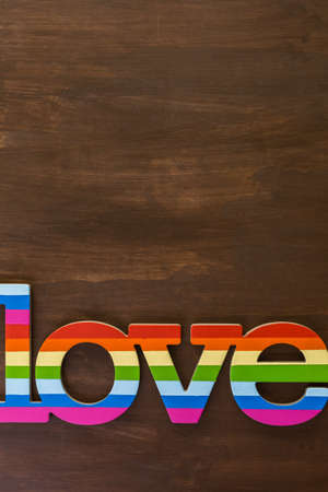 Rainbow Gay Pride Love sign on wood background.の写真素材
