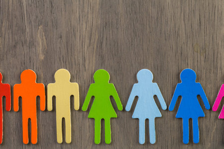 Rainbow Gay Pride male and female figures on wood background.の写真素材