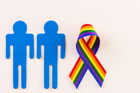 Rainbow Gay Pride male nad female cutouts on a white background.の写真素材