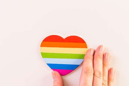 Rainbow Gay Pride heart on a wood background.の写真素材