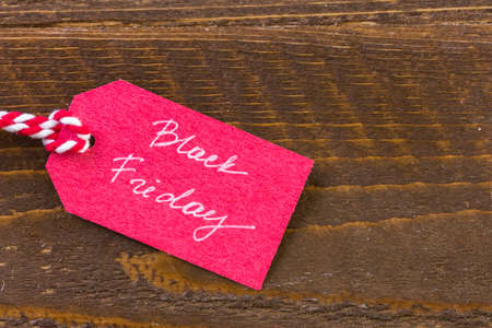 Tags with sale sign on wood board.の写真素材