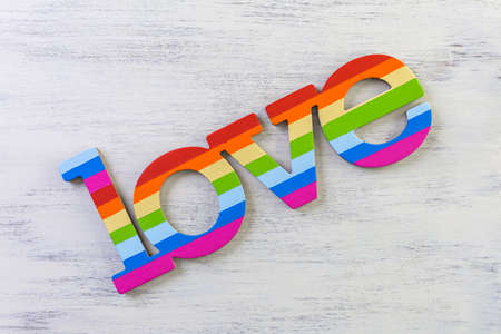 Rainbow Gay Pride love sign on wood background.の写真素材