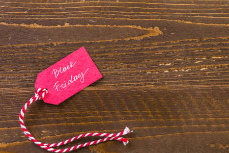 Tags with sale sign on wood board.の写真素材