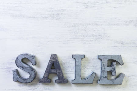 Tags with sale sign on wood board.の写真素材
