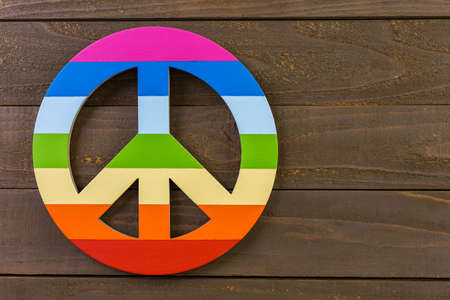 Rainbow Gay Pride peacce sign on wood background.の写真素材