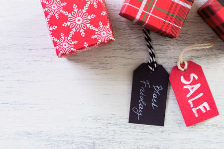 Tags with sale sign on wood board.の写真素材