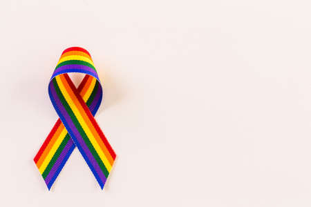 Rainbow Gay Pride ribbon on a white background.の写真素材