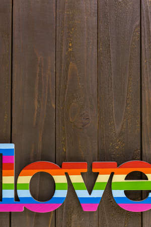 Rainbow Gay Pride love sign on wood background.の写真素材