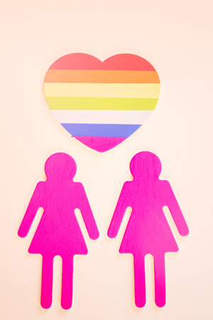 Rainbow Gay Pride male nad female cutouts on a white background.