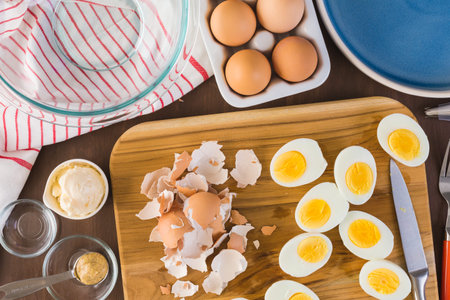 Preparing deviled eggs with organic eggs for appetizer. Step by step recipe.