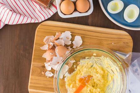 Preparing deviled eggs with organic eggs for appetizer. Step by step recipe.の写真素材
