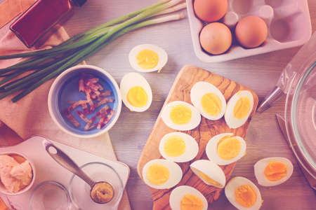 Preparing deviled eggs with organic eggs for appetizer. Step by step recipe.の写真素材