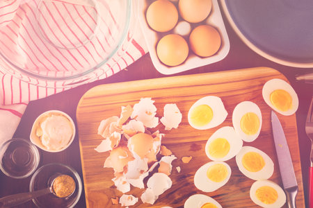 Preparing deviled eggs with organic eggs for appetizer. Step by step recipe.